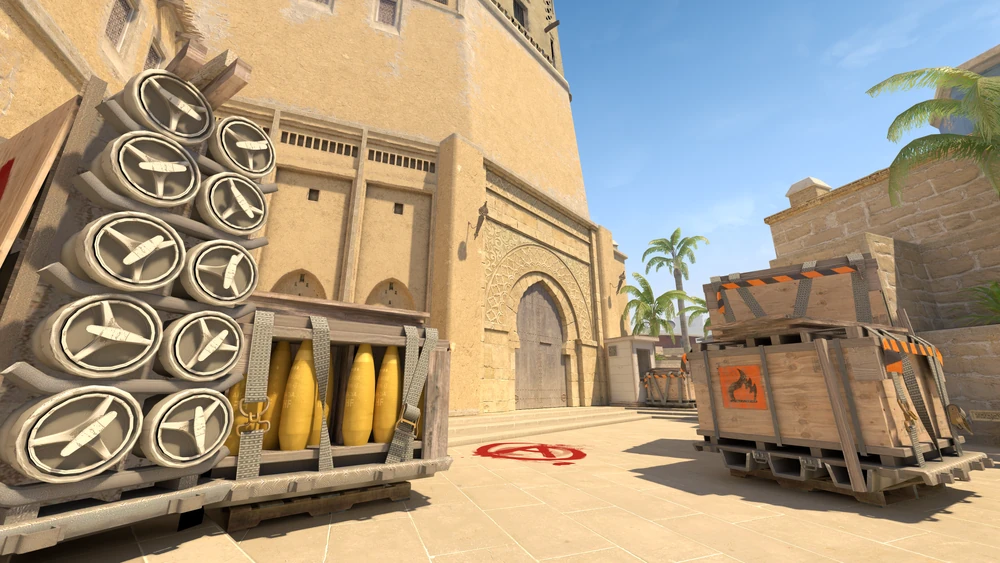 CS2 Mirage bombsite with crates and palm trees